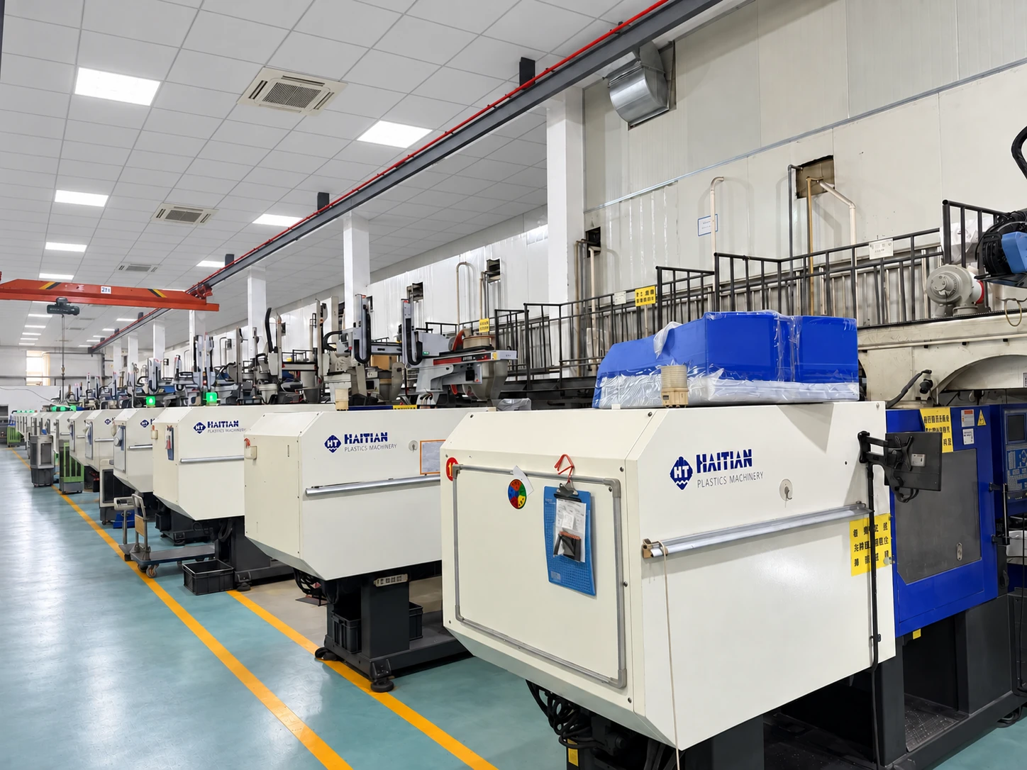 Row of injection moulding machines in Hongtu's workshop